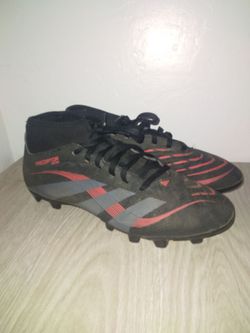 Red and black predators soccer cleats