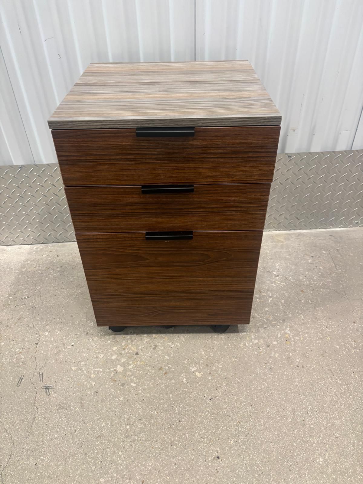 Three 3 drawer File Cabinet wood grain decor. 23” high , 16” Depth , 16” Wide . $60