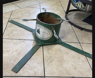 Santa’s Sturdy Tree Stand Holds Up To A 12 Foot Tree