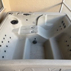 Spacious outdoor hot tub with multiple jets. Outdoor Hot Tub Barely used, less than 2 years old, works perfectly, come see in person! Paid $3300.