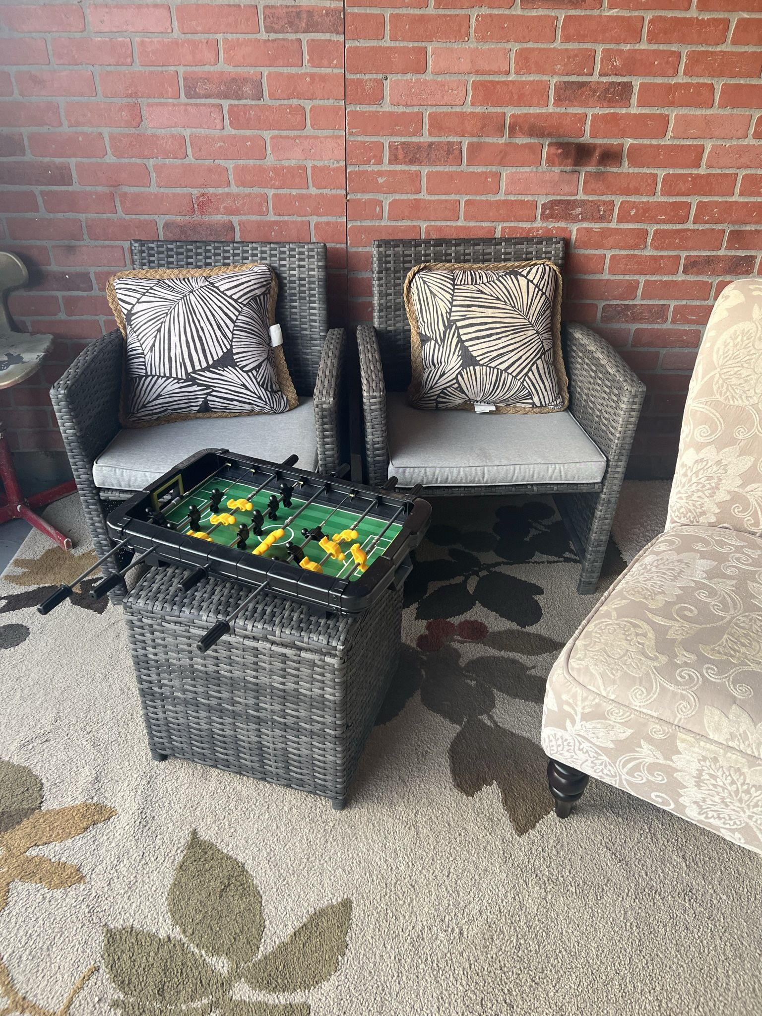 To wicker chairs and ottoman