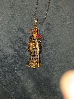 Santa Muerte gold pendant
