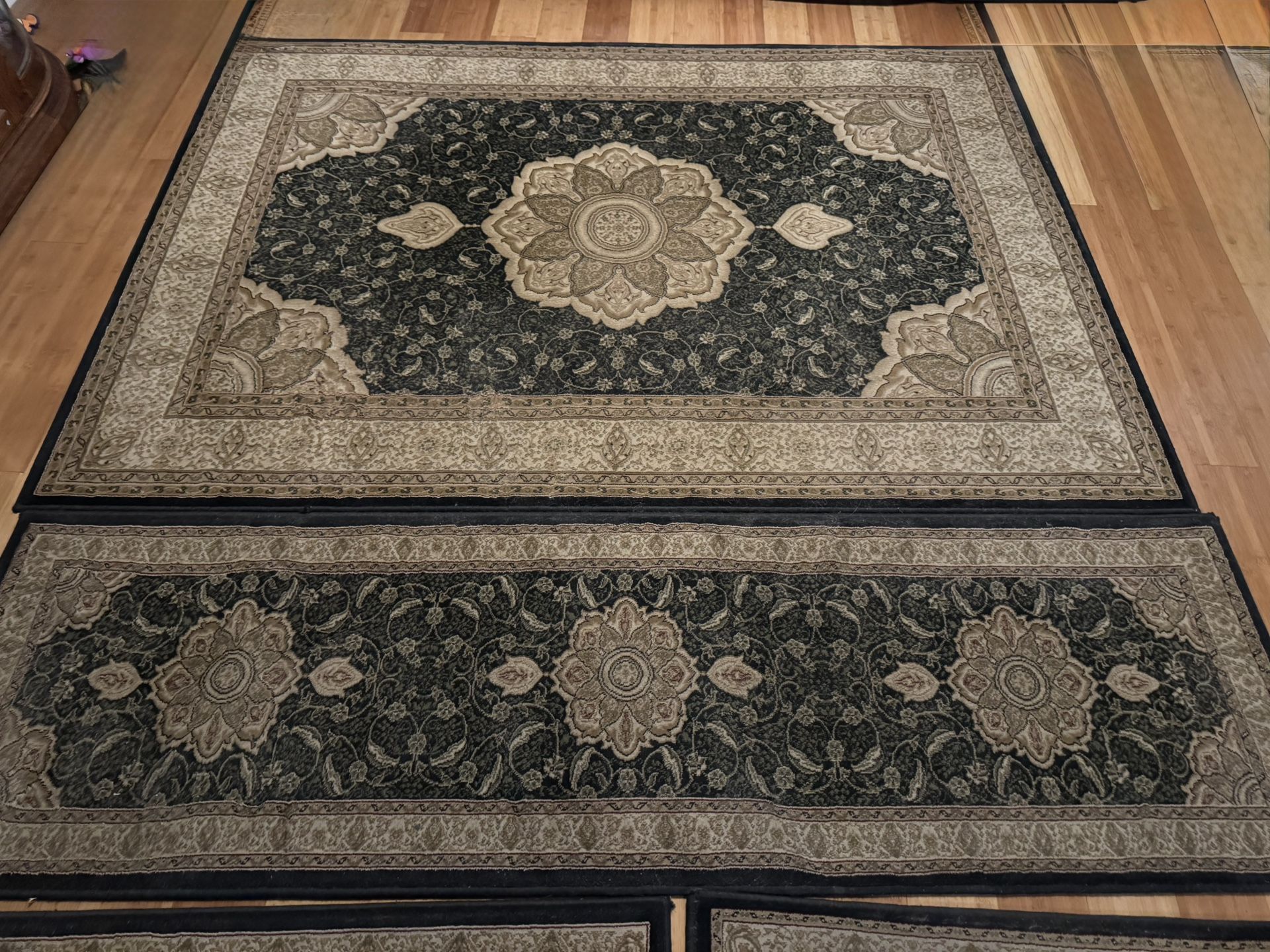 Black Area Rug & 3 Matching Rugs