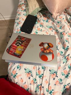 Apple MacBook Laptop with Stickers