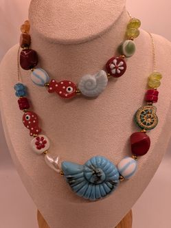 Collar y pulsera playera en acero inoxidable