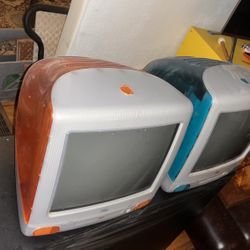 iMac orange and blue with keyboards