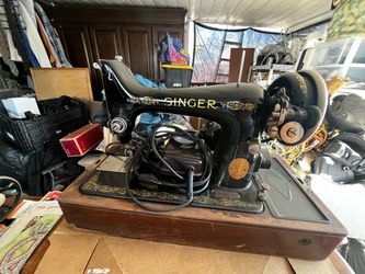 Antique Singer sewing machine with wood cover