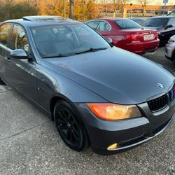 2007 BMW 328i /// 
with Black Rims and red brake calipers - Aftermarket touchscreen HeadUnit -Rearview Camera 

FINANCING AVAILABLE THROUGH LENDERS!
C