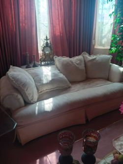 White couch puffy cushions.