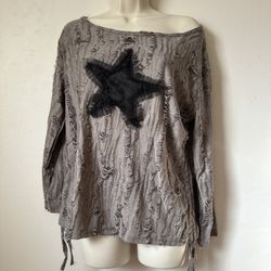 Elevate your style with this chic gray top featuring a bold star pattern. Perfect for casual outings or a night out, this top combines comfort with a 