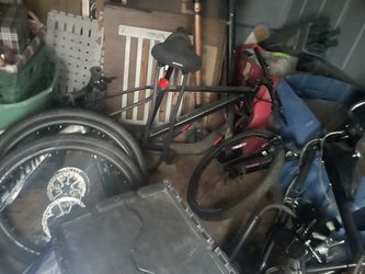 Gas/electric Bike And Then There’s Two Bike Frames In Back And Tires 