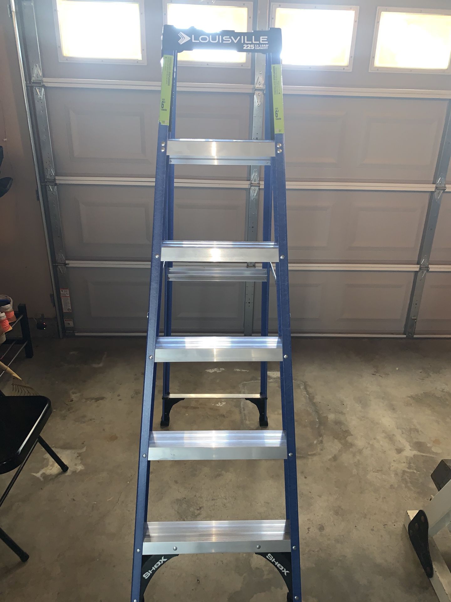 New 6’ blue Fiberglass Ladder. Never used.225 lbs Capacity.$65Firm.