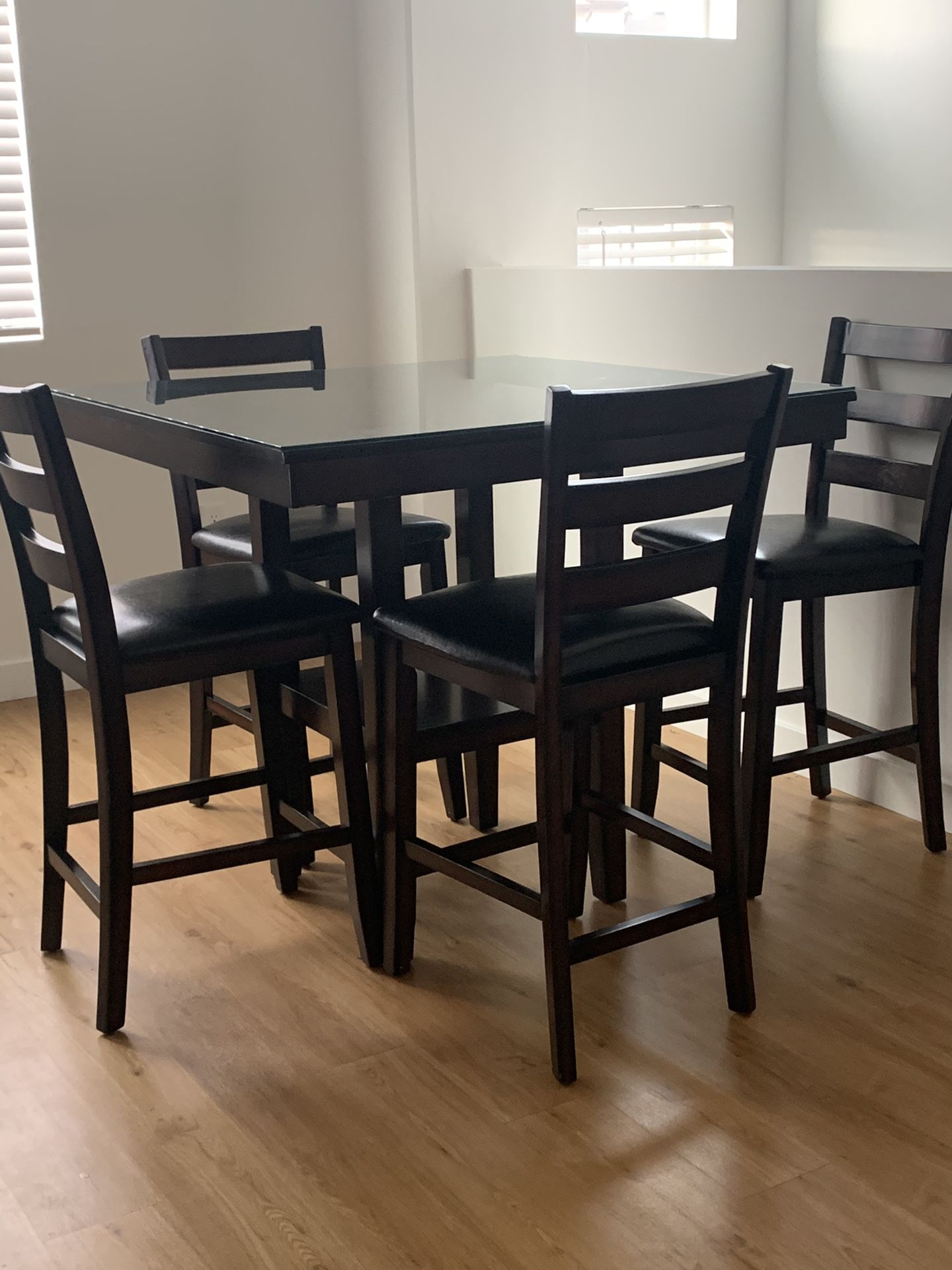 Brown wood dining table with top glass & 4 chairs