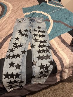 Light Wash Jeans with Black Star Patches