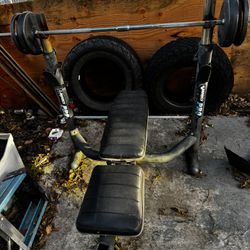 Punching Bag With Pull Up Bar  And Bench Press And Primo Water 