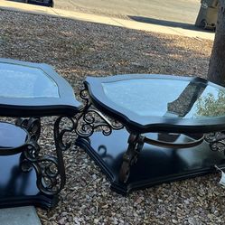 The Coaster Home Furnishings Laney Rectangular Coffee Table features a glass top, engineered wood construction, and ornate metal scrollwork