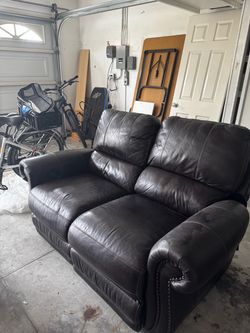 Jeromes Dark Brown Leather Reclining Loveseat