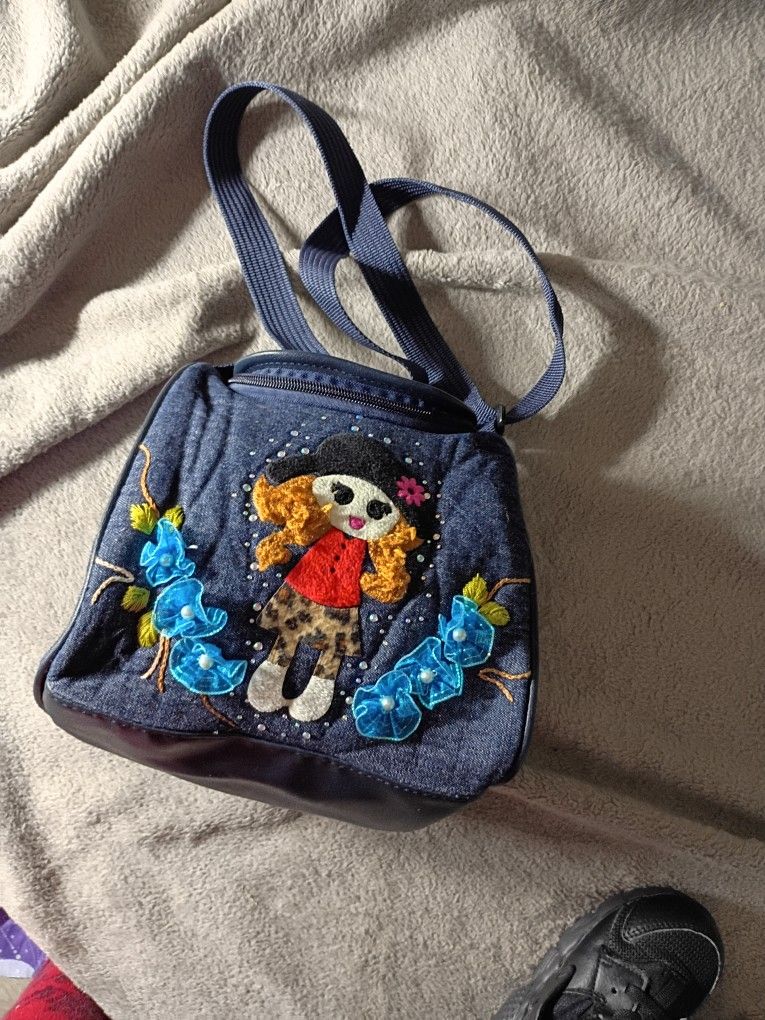 Lunch Box Cloth Bag Material Adjustable Strap With A Little Girl Sewn On The Front