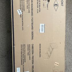 Twin size bed frame with gray headboard
