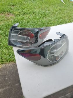 Mazda CX-7 tail light assembly. RH and LH