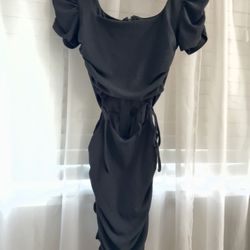 Black mini dress with ruched detail and open stomach