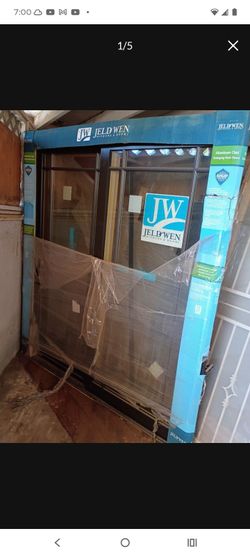 72x80 new construction sliding door left hand, aluminum clad outside bronze,wood inside, special order door available now