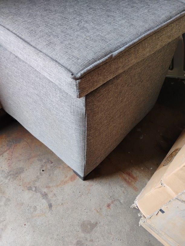Ottoman Grey Fabric w Black Feet. Storage