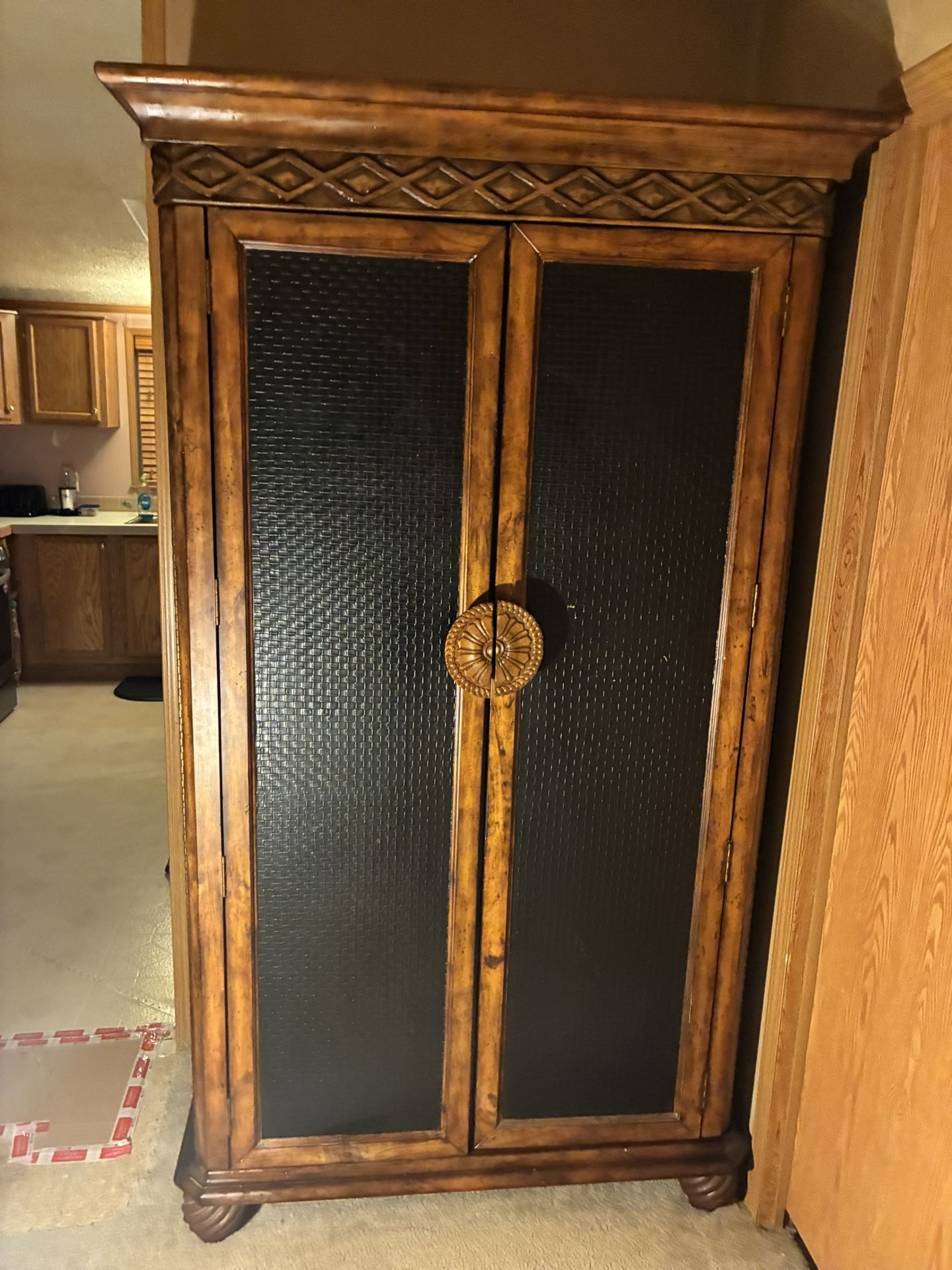 Armoire with Black Leather Front.