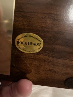 Rock head figure with camera.