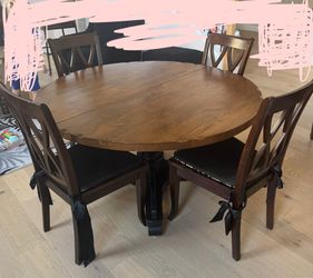 Solid Wood Round Dining Table with Two Leaves – $75