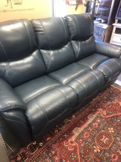 Genuine leather power reclining sofa