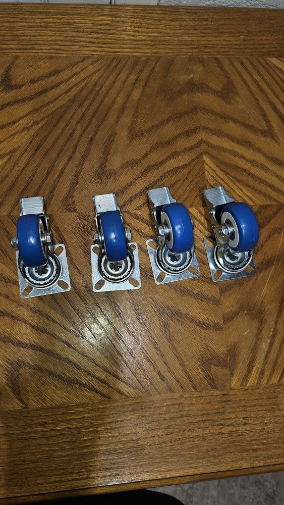 LOCKING BLUE WHEEL CASTERS LIKE NEW