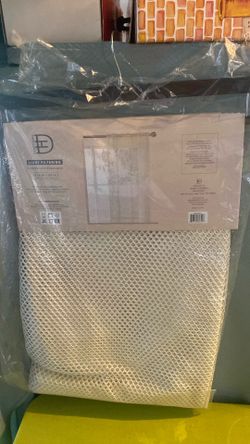 Light filtering drapery panels