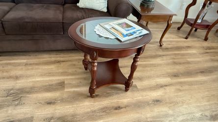 Oval wooden table with glass top