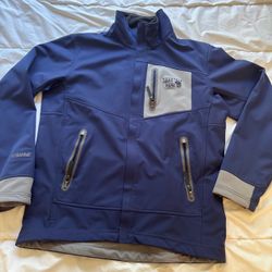 Durable Mountain Hardwear softshell jacket with warm lining, dark blue men’s medium.