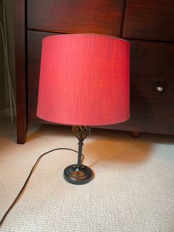 Black base with red lampshade table lamp