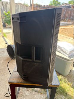 Electro voice speaker with wires, champion bag, and a pole