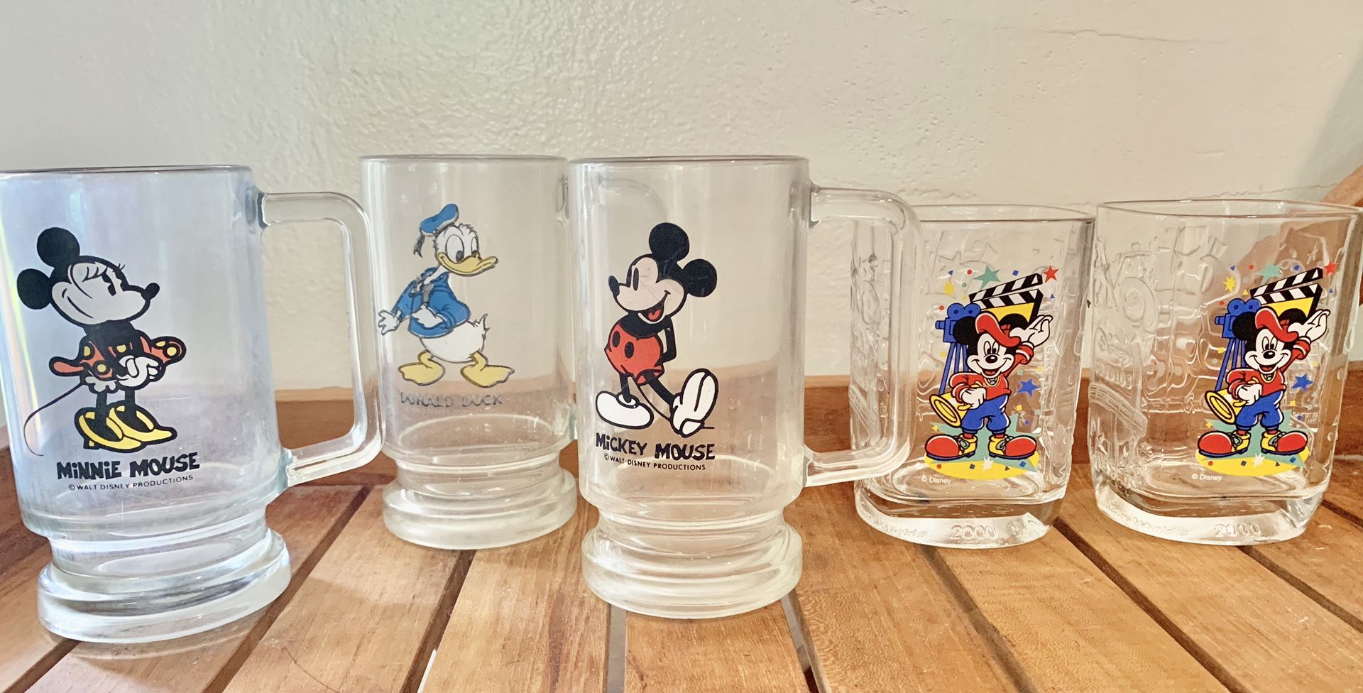Disney Mickey, Minnie, and Donald vintage beer glasses, also included are two vintage McDonald’s Disney Mickey Director’s collectors glasses