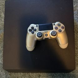 PS4 Pro In Great Condition With a Gold Remote And All Cords.