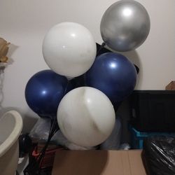 One silver balloon two blue balloons and two white balloons total willows five