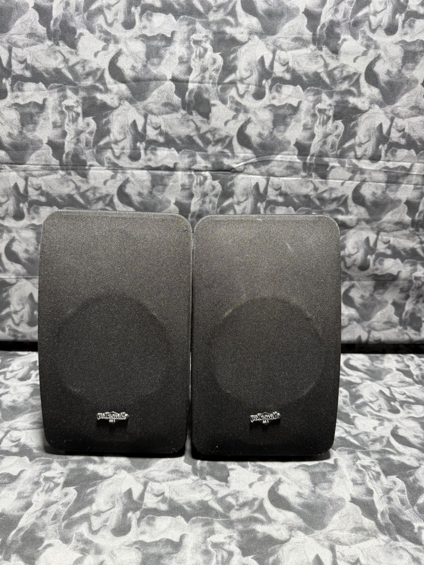 The Polk Audio M Series M1 Bookshelf/Satellite Speakers are high-end, compact speakers designed to provide clear and powerful sound. With a sleek rec