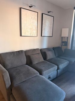 Grey couch with storage in the inside