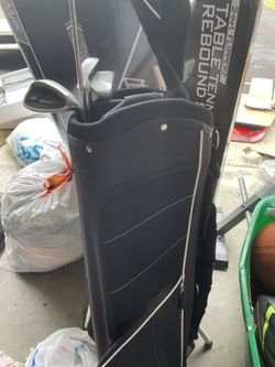 Golf Bag with a few golf clubs 