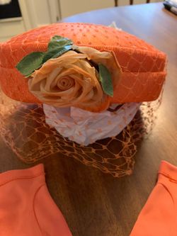 A vintage 1960s orange pillbox hat
