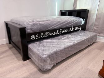 Twin bed with pullout mattress