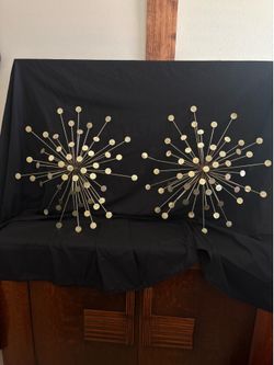 Gold metal sunburst wall sculpture