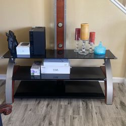 T.V. STAND   HOLDS  UP  75   INCH  TV   OR BIGGER TO 