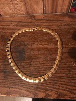 Woman’s gold necklace