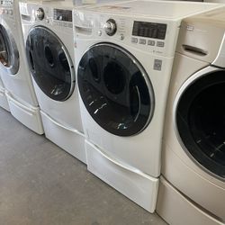 LG washer and gas dryer on pedestal with 90 day warranty