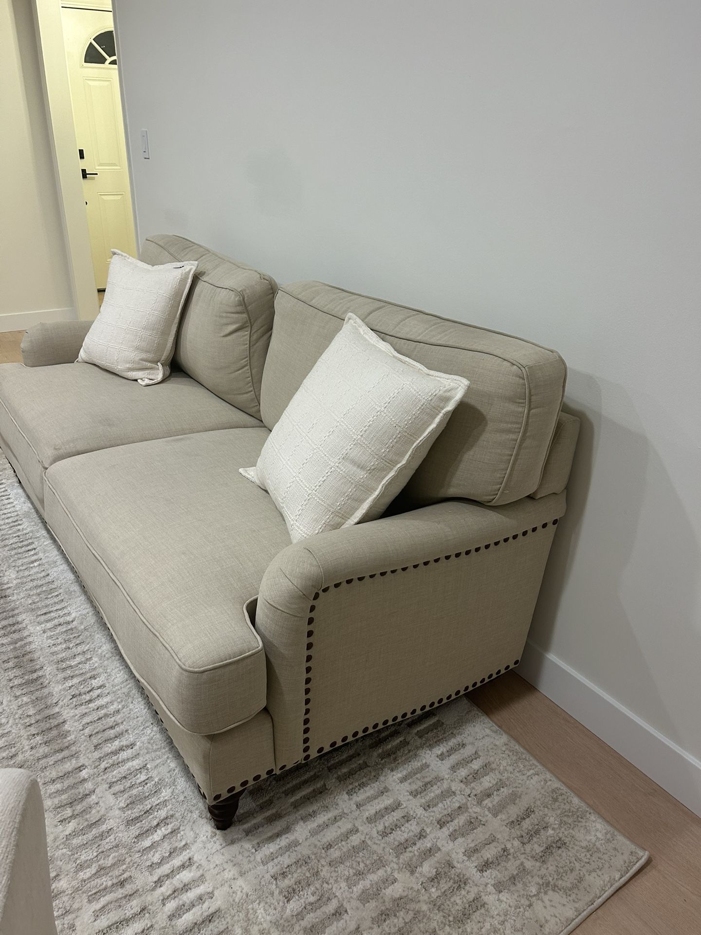 Beige Linen Couch With Accent Pillows
